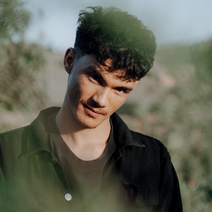 Kaveri Mehta, Lead Design Curator at CalmOriginProgress, reviewing corporate floral arrangements